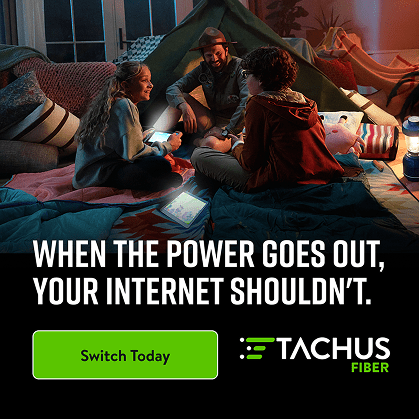 A family in a makeshift tent in their living room, illuminated by tablets, with the text "WHEN THE POWER GOES OUT, YOUR INTERNET SHOULDN'T."