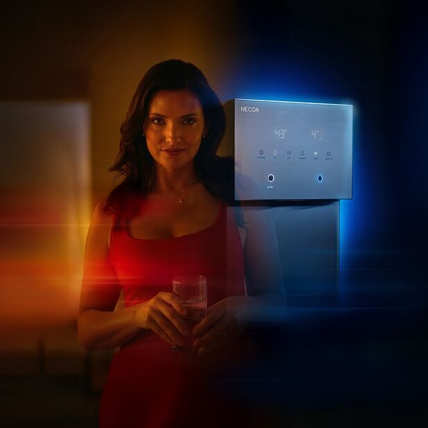 A woman in a red dress holds a glass of water next to a sleek digital NECOA water dispenser, illuminated by a split of warm amber light on the left and cool blue light on the right.