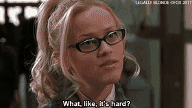 Elle Woods from Legally Blonde, wearing black-rimmed glasses and with her blonde hair tied up, tilts her head with a confident expression. The caption at the bottom reads, 'What, like, it's hard?'