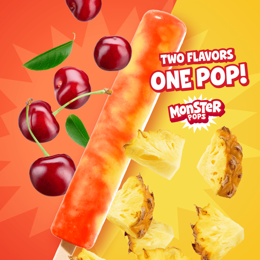 An advertisement for Monster Pops featuring a long, swirled orange and red ice pop diagonally across a split background. The left half is orange with floating cherries and green leaves, and the right half is yellow with floating pineapple chunks. Text reads 'TWO FLAVORS ONE POP!' above the 'MONSTER POPS' logo.