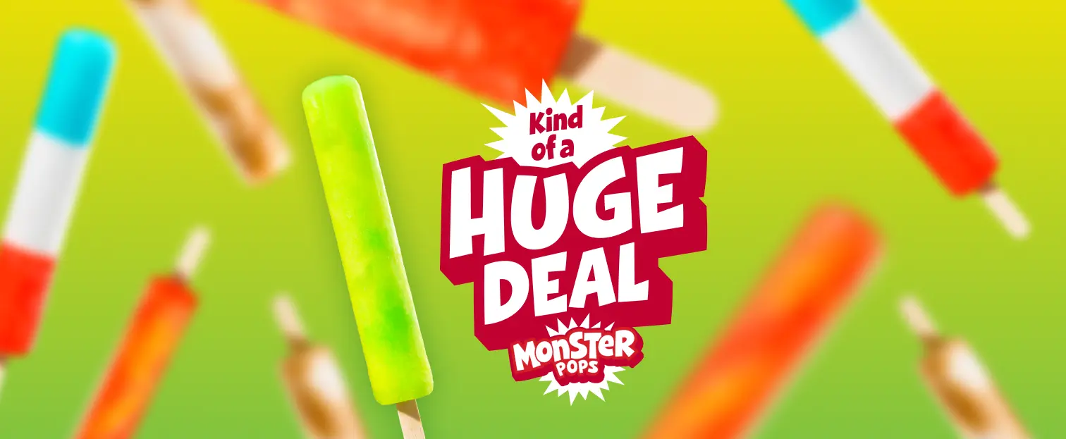 An advertisement for Monster Pops featuring a sharp, bright green popsicle in the foreground and other blurred colorful popsicles on a green-yellow gradient background, with the text 'Kind of a HUGE DEAL MONSTER POPS'.